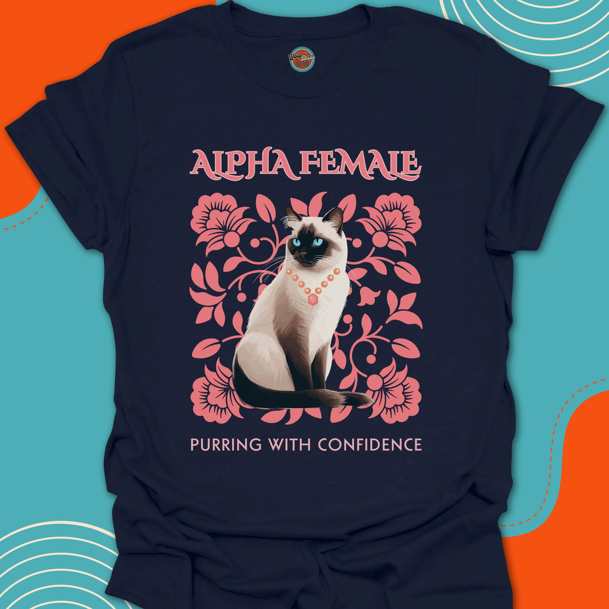 Navy blue t-shirt with a Siamese cat graphic on a pink flowers background design and "Alpha Female purring with confidence" text