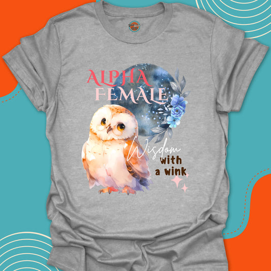 Gray t-shirt with a cute baby owl and a large moon and blue flowers graphic and "alpha female, wisdom with a wink" text