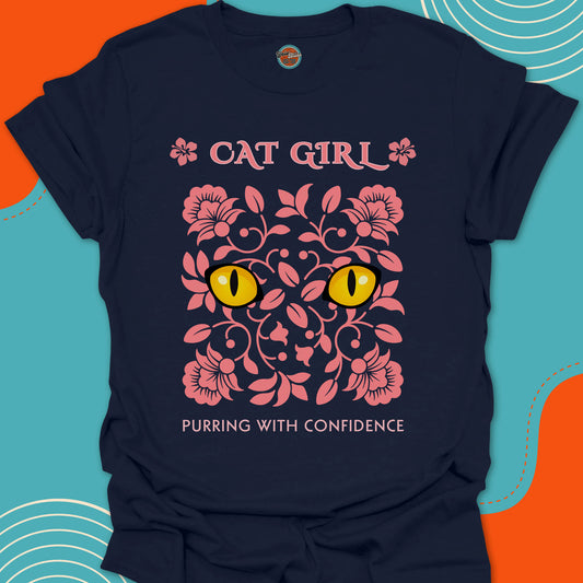 Navy blue t-shirt with pink floral design and yellow cat eyes graphic along with "Cat Girl, purring with confidence" text