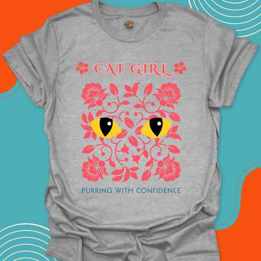 light gray t-shirt with beautiful pink floral design and stylish yellow cat eyes graphic along with "Cat Girl, purring with confidence" text