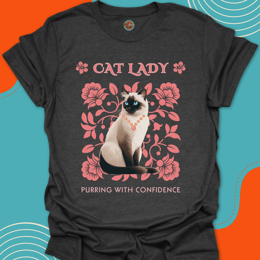 Dark Gray Navy blue t-shirt with a Siamese cat graphic on a pink flowers background design and "Cat Lady, purring with confidence" text
