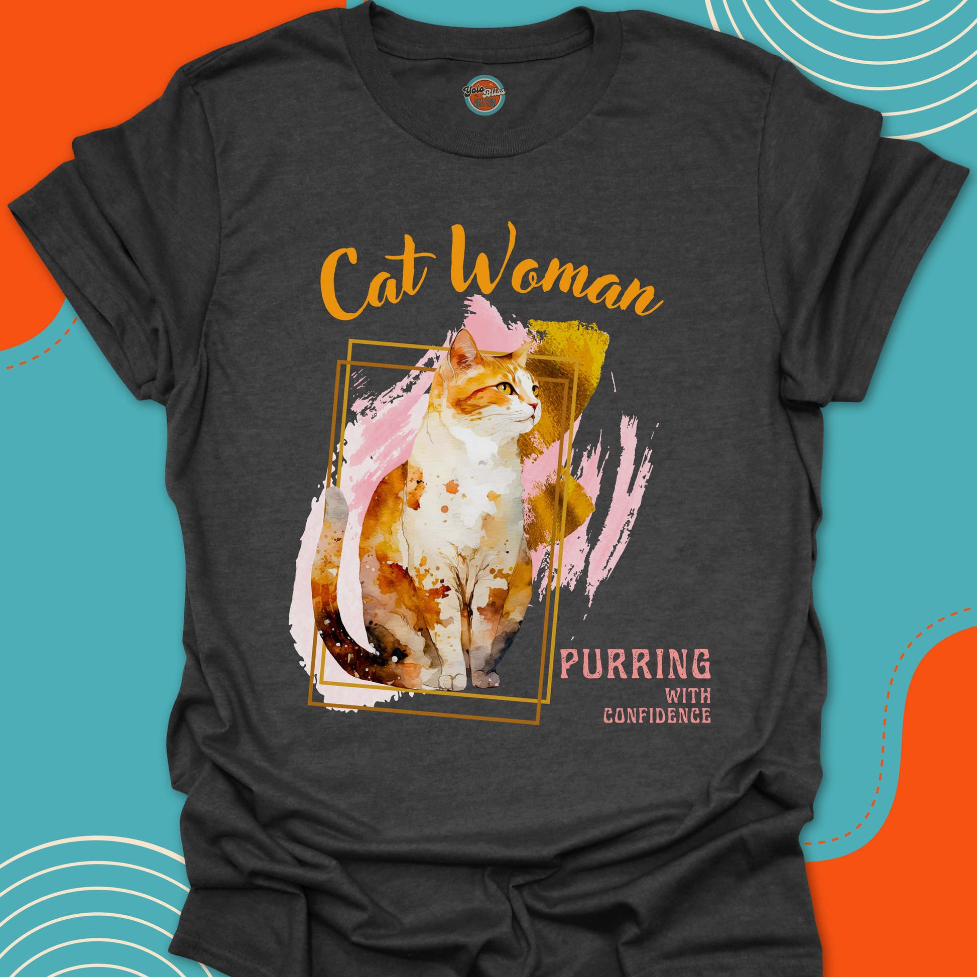 Dark Grey t-shirt with a orange and white cat graphic on a painted background design and "Cat Woman,  purring with confidence" text