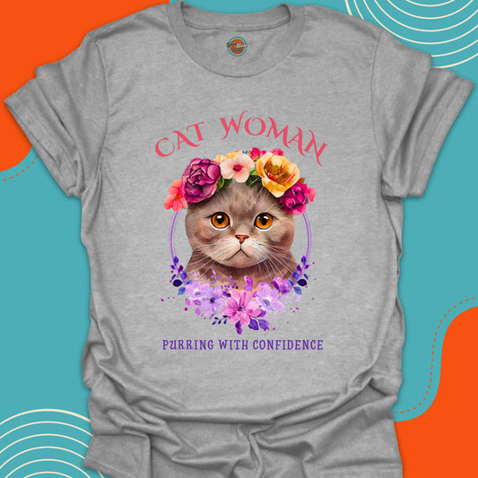 Light gray t-shirt with a super cute kitten with a crown of colorful flowers on her head graphic and "Cat Woman, purring with confidence" stylish text