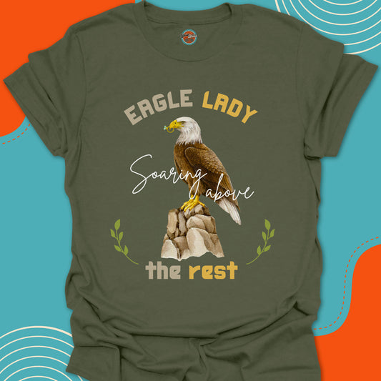 Military Green t-shirt with an eagle on a rock with a diamond ring in his beak graphic and "eagle lady, soaring above the rest" text 