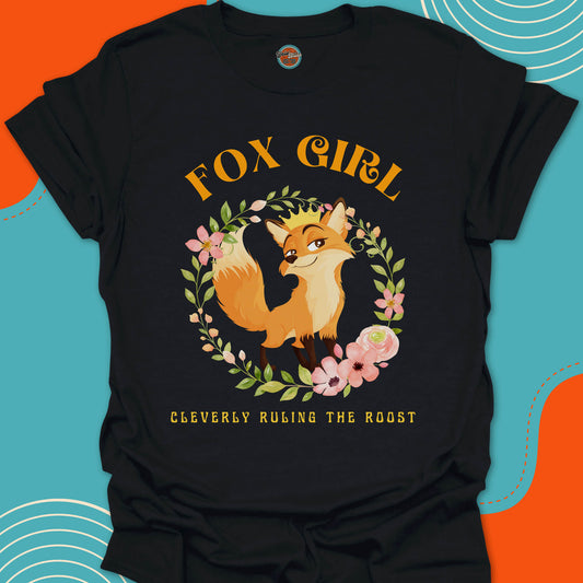 Black t-shirt with a cute fox wearing a golden crown on her head and floral circular arrangement graphic and "Fox Girl, cleverly ruling the roost"