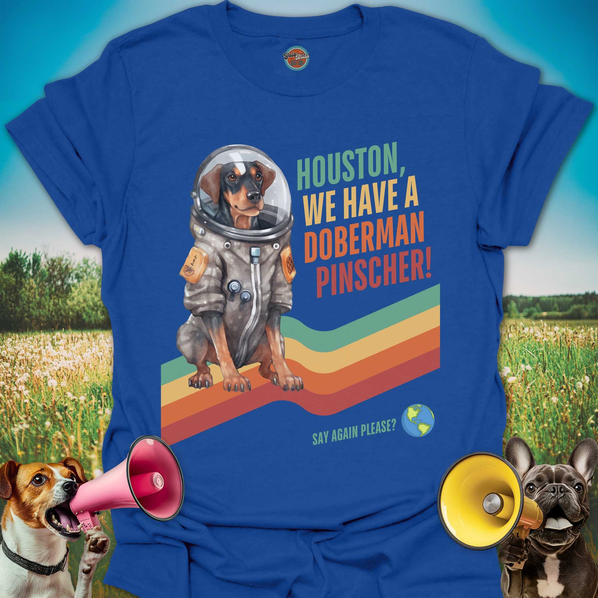 Blue t-shirt with a doberman pinscher in an astronaut suit graphic and text on a colorful background