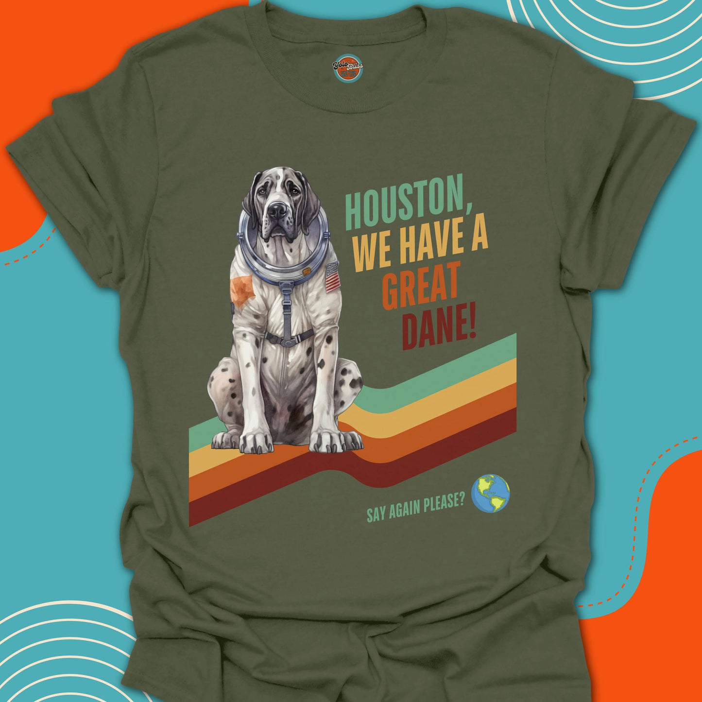 Green t-shirt with a dog in an astronaut suit graphic and text on a colorful background