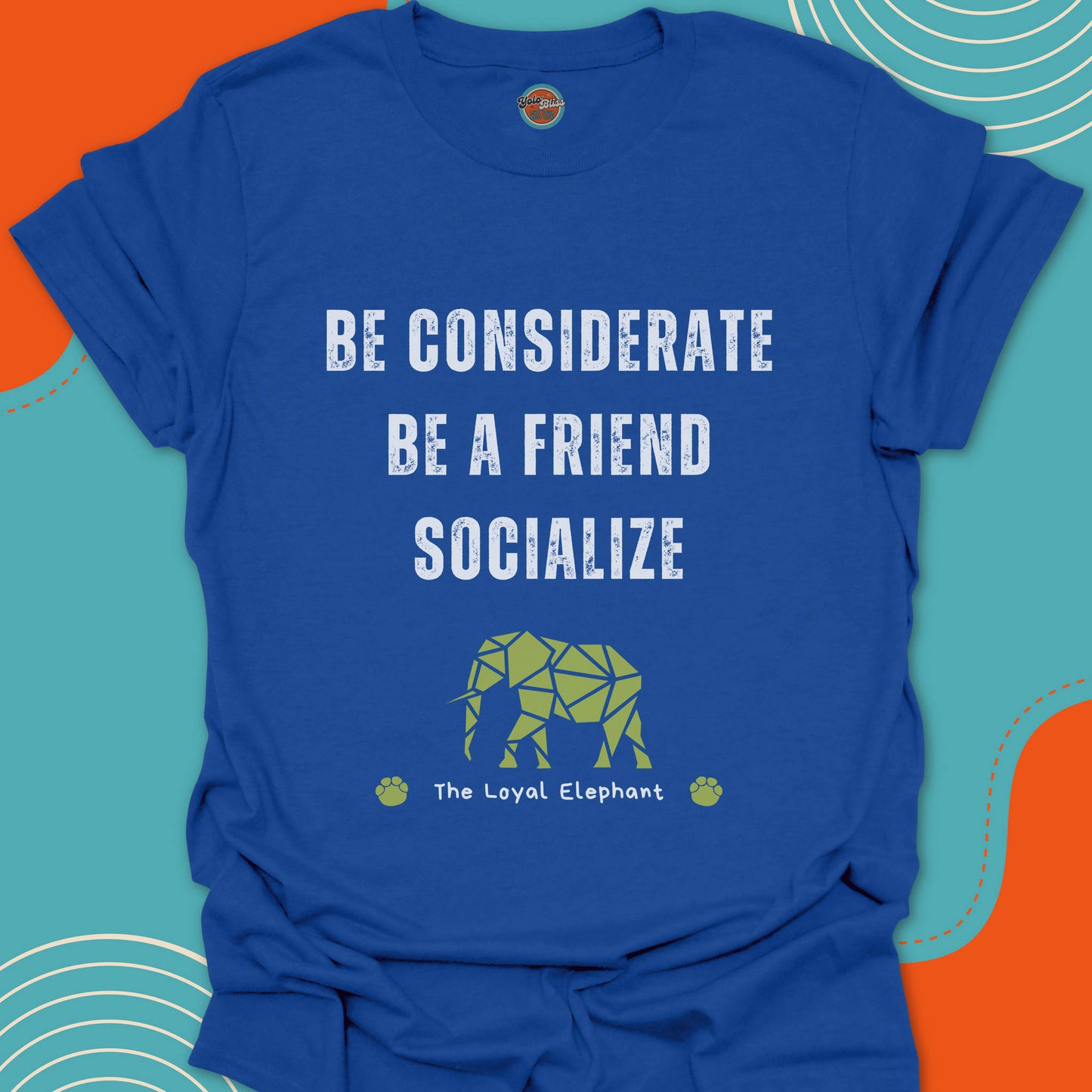 Royal blue t-shirt with motivational text "Be considerate, be a friend, socialize" and green puzzle elephant graphic