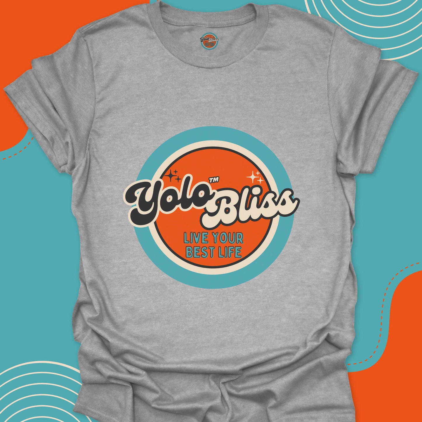 Light gray t-shirt with a large official "YoloBliss, Live your best life" orange and turquoise logo on the front. Yolo Bliss