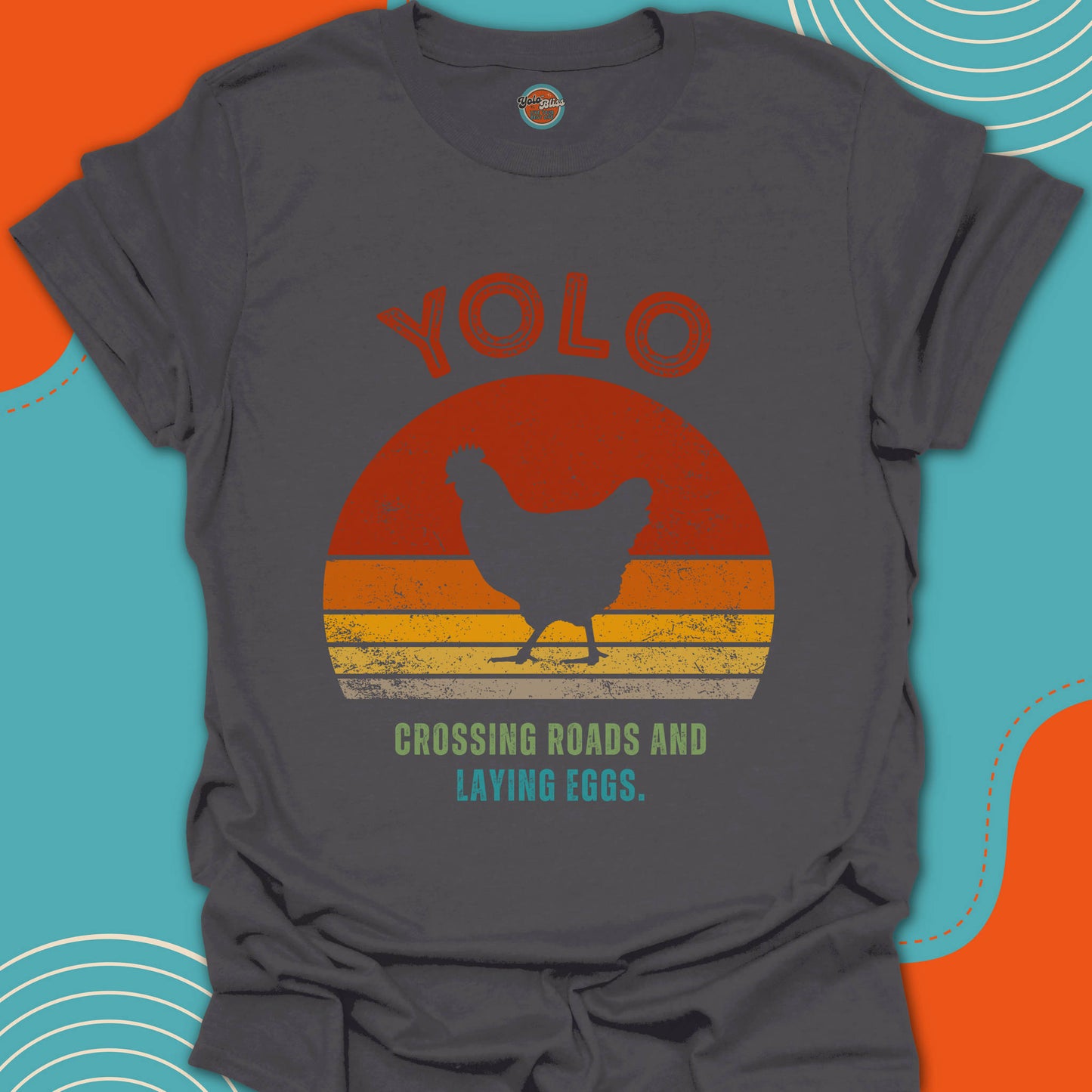 Gray t-shirt with a walking chicken graphic and crossing road text on a popular sunset background
