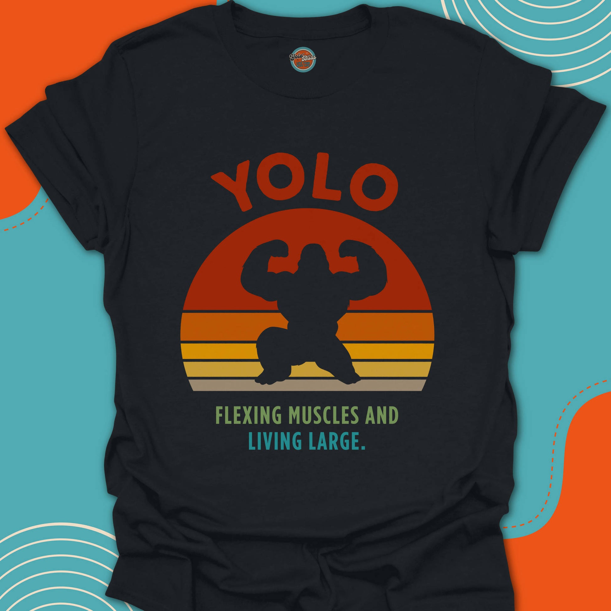 Black t-shirt with 'YOLO Flexing Muscles and Living Large' text and a large gorilla graphic design on a funky sunset background