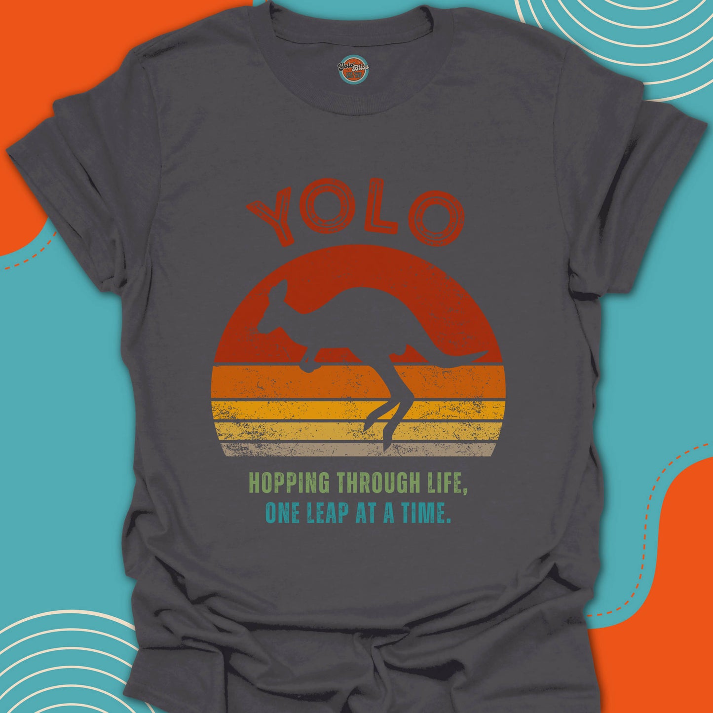 Gray t-shirt with a kangaroo graphic and 'YOLO' text on a warm sunset background