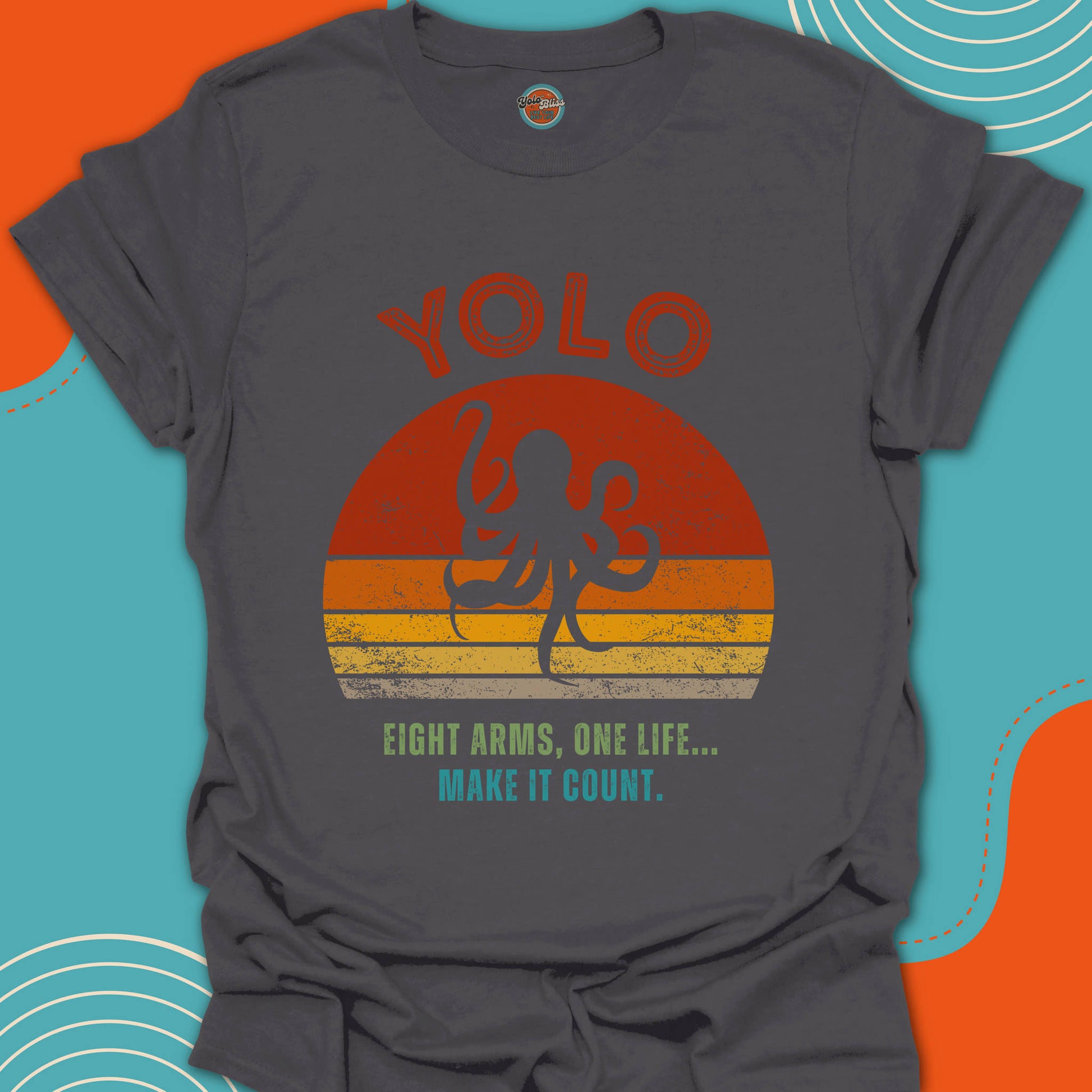 Gray t-shirt with 'YOLO' and an octopus design on a warm colors background